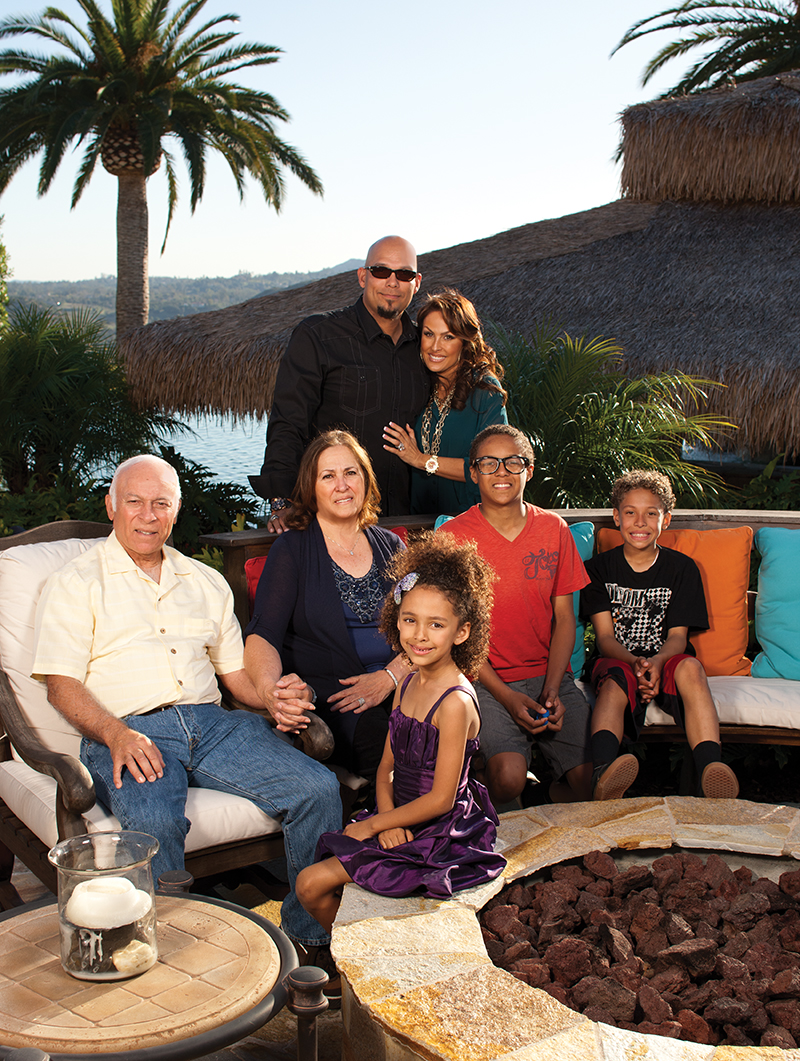 David and Rebecca Justice, in the background, are surrounded by family at Villa Justicia: Rebecca's parents Dennis and Esperanza Villalobos, daughter Raquel and sons J.R. and D.J.