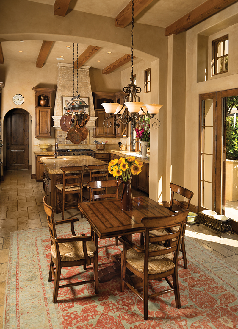Treasured copper pots from Italy hang from the pot rack in the kitchen where Harry is known as a first-class baker and cook