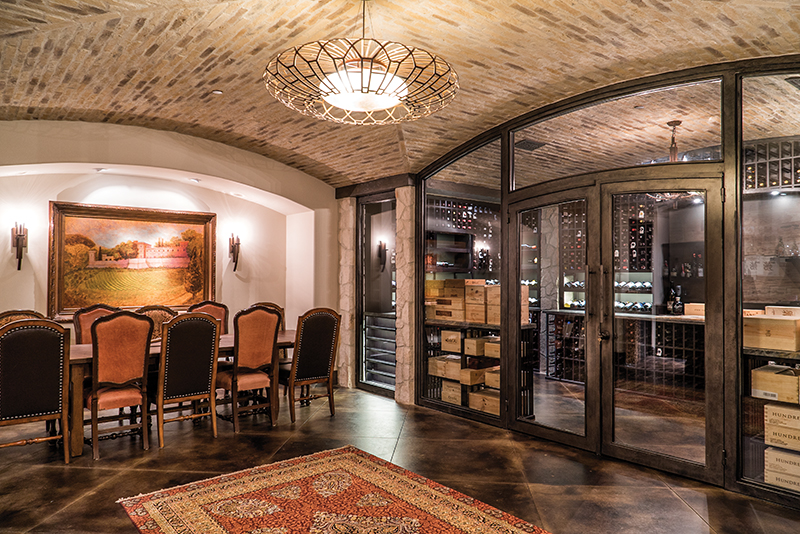 The couple’s expansive glass-walled wine cellar can hold 2,500 bottles, and is the perfect spot for wine dinners