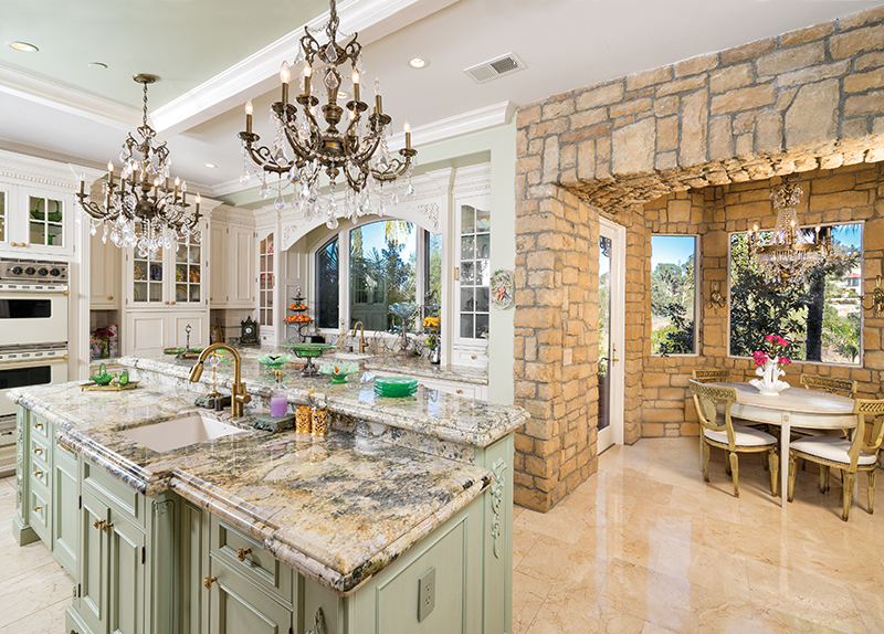 Marjan doubled the size of the French Country kitchen, enlarged the window, and replaced dark cabinetry with light